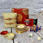 LOVENSPIRE Rakhi Gift Hamper for Brother 2PC Ganesha Rakhi with Candle Holder Ceramic Key Chain Roli Chawal Rakshabandhan Card Chocolates with Premium Brocade Gift Box - Bracelet for Bhai Bhabhi