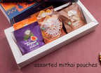 Ghasitaram Gifts Jaiccha Christmas Hamper Basket with PLum cake, chocolates, dryfruits, beetroot chips and Christmas décor