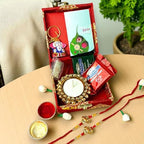 LOVENSPIRE Rakhi Gift Hamper for Brother 2PC Ganesha Rakhi with Candle Holder Ceramic Key Chain Roli Chawal Rakshabandhan Card Chocolates with Premium Brocade Gift Box - Bracelet for Bhai Bhabhi