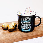 Pavilion Gift Company - Fishing Legend - Ceramic 13-ounce Campfire Mug, Double Sided Coffee Cup, Fishing Mug, Fishing Gifts For Men Funny, 1 Count (Pack of 1), 3.75” x 5” x 3.5”, Black/Blue