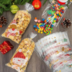 PADELO 100 Pcs Christmas Treat Bags - Merry Christmas Candy Bag, Plastic Xmas Cellophane Cello Goodie Goody Cookie Gift Snack Bags with Twist Ties for Goodies Present Wrap Xmas Party Favors Supplies