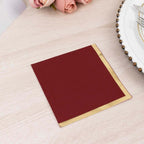 100 Count Burgundy 2-Ply Paper Beverage Napkins with Gold Foil Edge, Soft Disposable Cocktail Napkins 18 GSM - 5"x5"