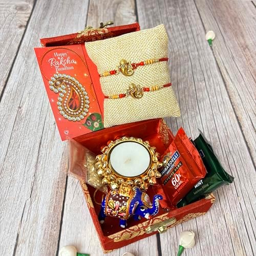 LOVENSPIRE Rakhi Gift Hamper for Brother 2PC Ganesha Rakhi with Candle Holder Ceramic Key Chain Roli Chawal Rakshabandhan Card Chocolates with Premium Brocade Gift Box - Bracelet for Bhai Bhabhi