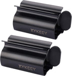 XYKEEY Toothpaste Tube Squeezer - Set of 2 Toothpaste Squeezer Rollers, Metal Toothpaste Tube Wringer Seat Holder Stand (Matt Black)
