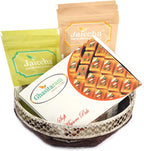 Ghasitaram Gifts Diwali Gifts Round Basket of Almonds, Raisins and Mysore Pak