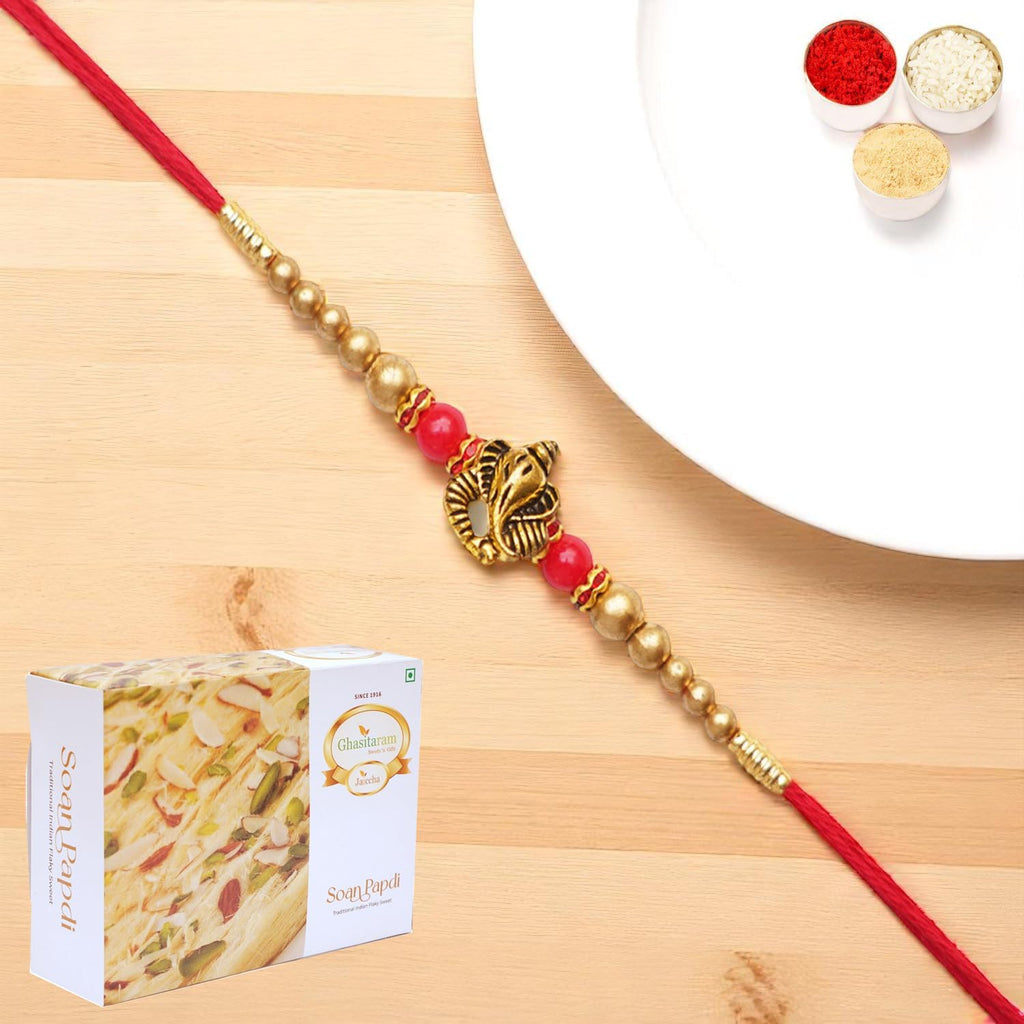 Ghasitaram Gifts Jaiccha Rakhis for Brother Rakhis Online - Y-26 Ganesha divine Rakhi with 200 gms of Soan Papdi