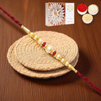 Ghasitaram Gifts Rakhi for Brother Rakhis Online - Y-83 Pearl rakhi with 200 gms of Kaju katli