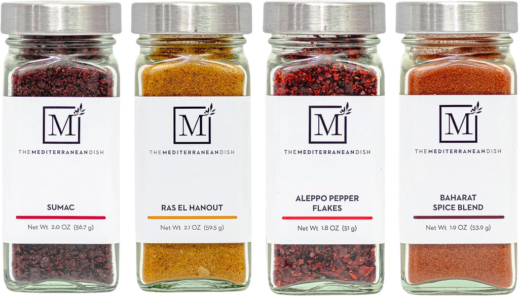 The Mediterranean Dish Exotic Middle Eastern Spice Bundle - Baharat, Ras El Hanout, Aleppo Pepper and Sumac - Gourmet Mediterranean Seasonings Set - Warm, Tangy and Aromatic Blends - Set of 4 Glass Bottles