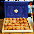 Ghasitaram Gifts Rakhi Gifts for Brothers Rakhi Sweets - Gujiya Box (800 GMS) with Beads Rakhi