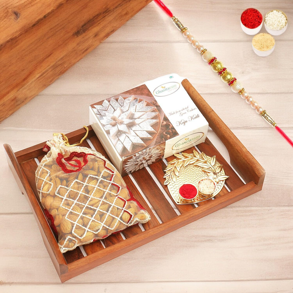 Ghasitaram Gifts Rakhi Gifts for Brothers Wooden Serving Tray with Kaju Katli, Almonds and Pooja Thali with Pearl Rakhi